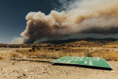 Adaptive Neuro-Symbolic Planning for Wildfire Evacuation Logistics Networks with Zero-Trust Governance Guarantees